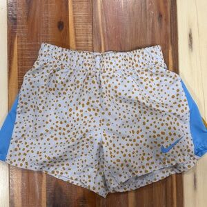 Nike Girl’s White and Gold Dotted Shorts with Blue Accents